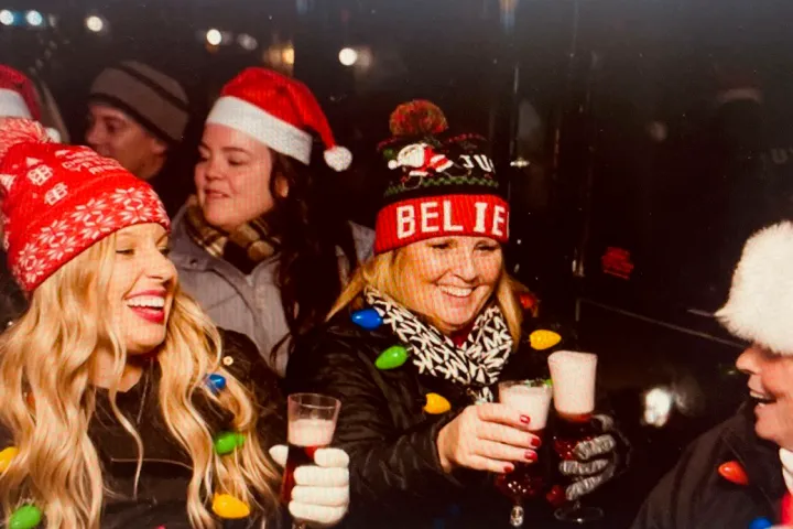 a group of people holding wine glasses
