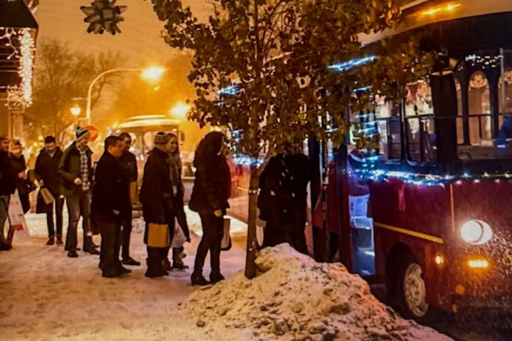 a group of people standing in front of a building