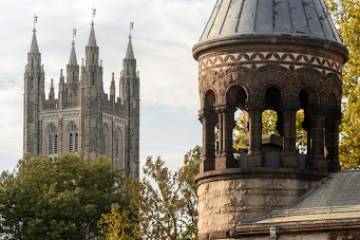 a large clock tower in front of a building