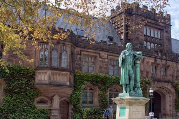 a large stone statue in front of a building