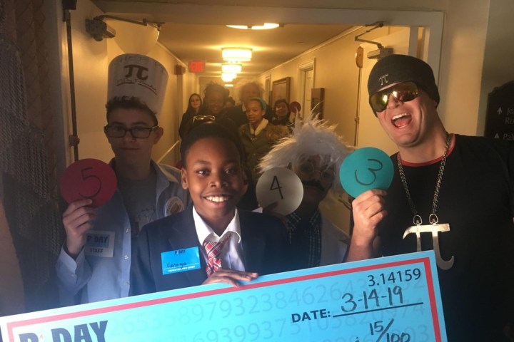 a group of people posing for the camera