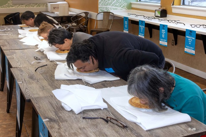 a man lying on a desk