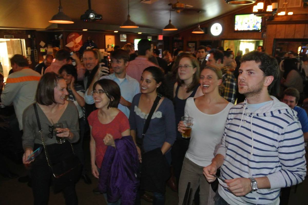10733862_10152524173582144_1681538343071562920_o a group of people standing in front of a crowd posing for the camera