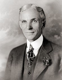 Henry Ford wearing a suit and tie