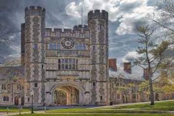 a clock tower in front of a building
