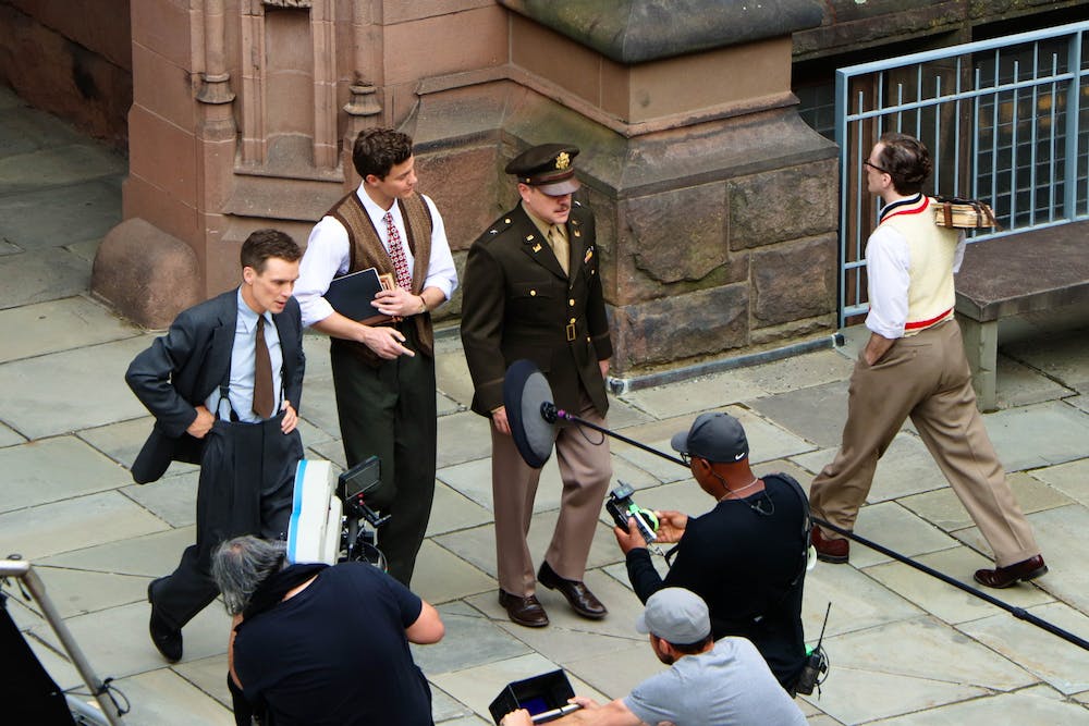 a group of people on a sidewalk